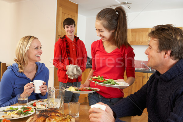 Helpful Teenage Children Serving Food To Parents In Kitchen Stock photo © monkey_business