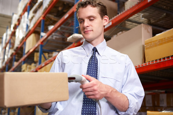 Businessman Scanning Package In Warehouse Stock photo © monkey_business