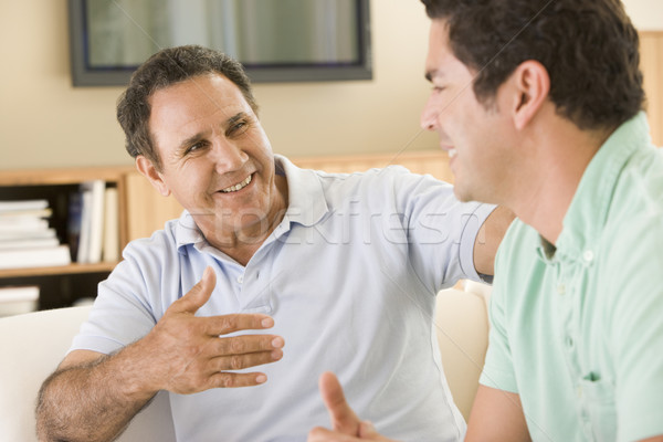 Twee mannen woonkamer praten glimlachend familie man Stockfoto © monkey_business