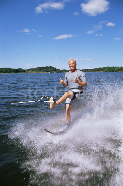 A young man water skiing Stock photo © monkey_business
