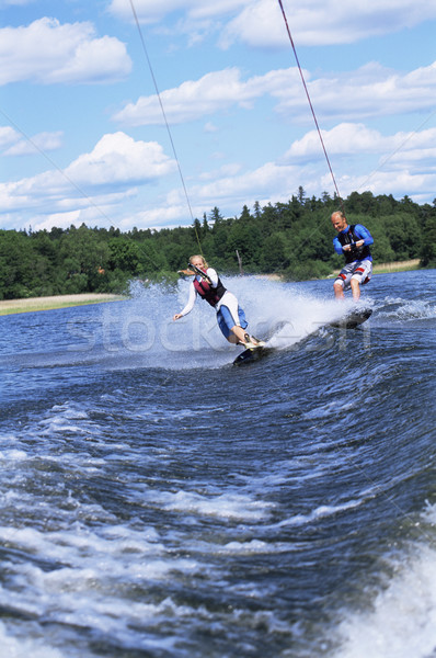 A man and woman water-skiing Stock photo © monkey_business