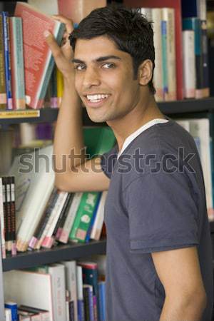 [[stock_photo]]: Homme · bibliothèque · livre · étudiant · éducation