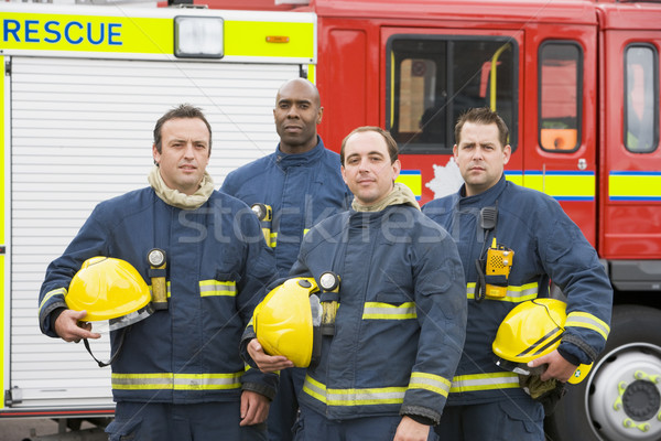 Retrato grupo bombeiros carro de bombeiros cor em pé Foto stock © monkey_business