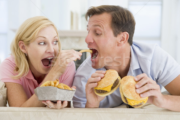 Couple Enjoying Burgers Together Stock photo © monkey_business