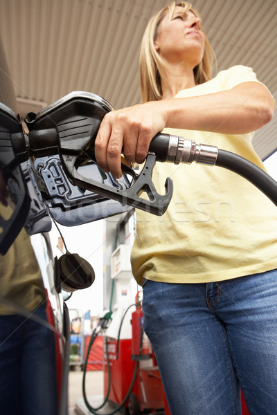 Female Motorist Filling Car With Diesel At Petrol Station Stock photo © monkey_business