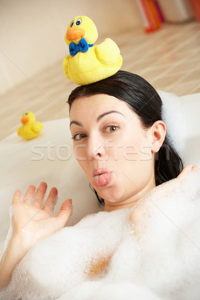 Woman Relaxing In Bubble Filled Bath Stock photo © monkey_business