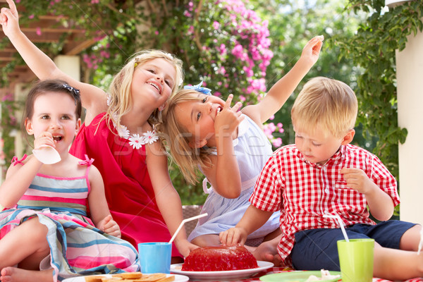 Grupo ninos comer aire libre té Foto stock © monkey_business