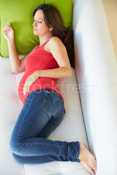 Overhead View Of Pregnant Woman Sleeping On Sofa Stock photo © monkey_business