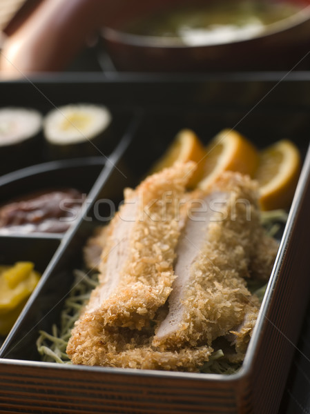 Tonkatsu Box and Miso Soup with Pickles and Sushi Stock photo © monkey_business