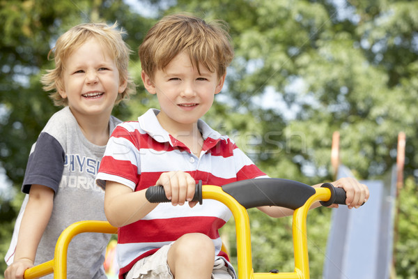 Two Young Boys Playing on Bike Stock photo © monkey_business