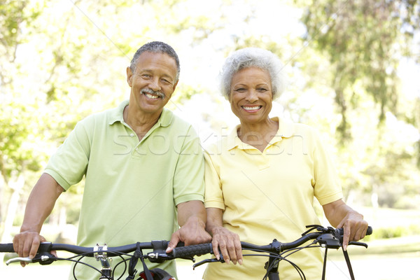 [[stock_photo]]: Couple · de · personnes · âgées · équitation · vélos · parc · homme · heureux