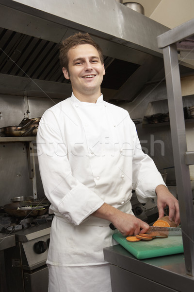 Male Chef Preparing Vegetables In Restaurant Kitchen Stock photo © monkey_business
