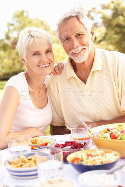 Senior Couple Enjoying Meal In Garden Stock photo © monkey_business