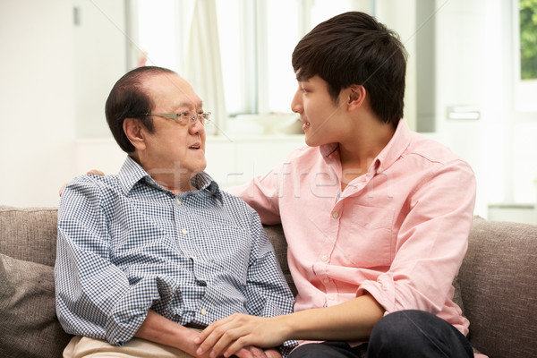 Portrait Of Chinese Father With Adult Son Relaxing At Home Stock photo © monkey_business