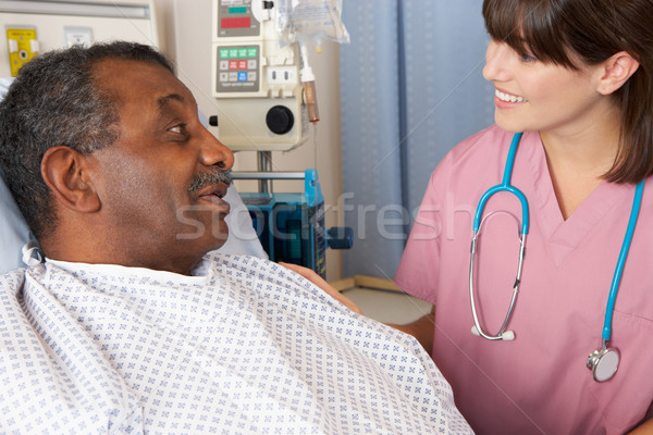 Nurse Talking To Senior Male Patient On Ward Stock photo © monkey_business