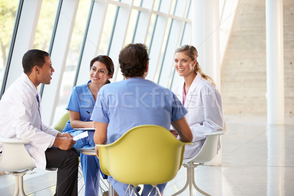 Medical Team Meeting Around Table In Modern Hospital Stock photo © monkey_business