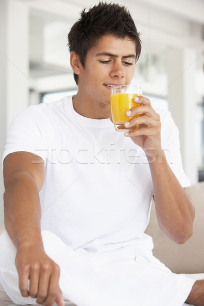 Stock photo: Young Man Drinking Orange Juice