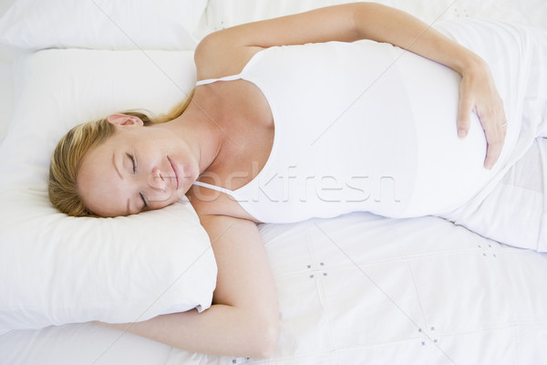 Imagine de stoc: Femeie · gravida · pat · dormit · femeie · mână · fericit