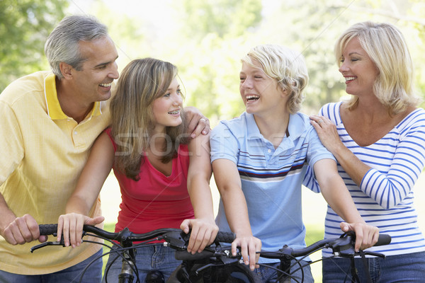 Family Cycling Through A Park Stock photo © monkey_business