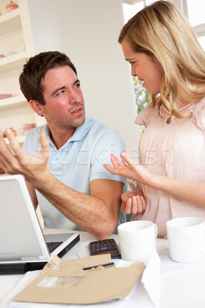 Young couple discussing their finance over laptop computer Stock photo © monkey_business