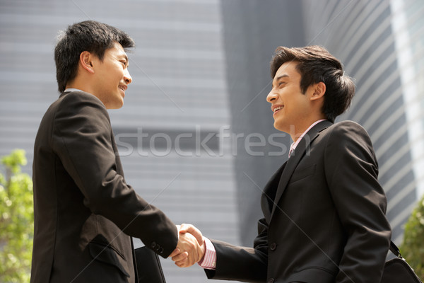 Deux affaires serrer la main à l'extérieur bureau affaires [[stock_photo]] © monkey_business