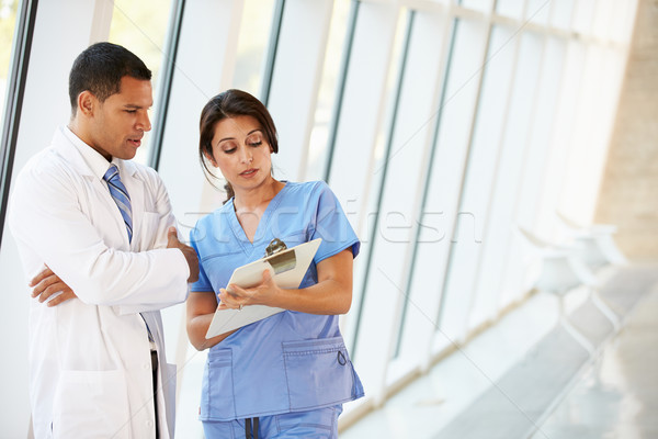 Medical Staff Having Discussion In Modern Hospital Corridor Stock photo © monkey_business