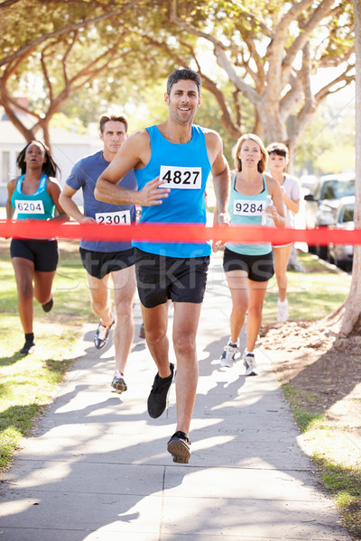 Masculin alergător castigator maraton femei fericit Imagine de stoc © monkey_business