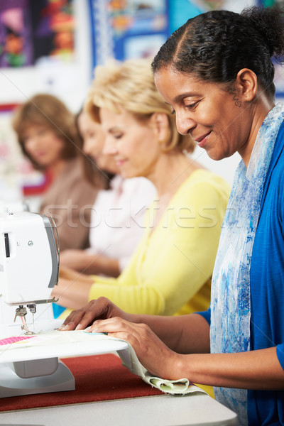 Group Of Women Using Electric Sewing Machines In class Stock photo © monkey_business
