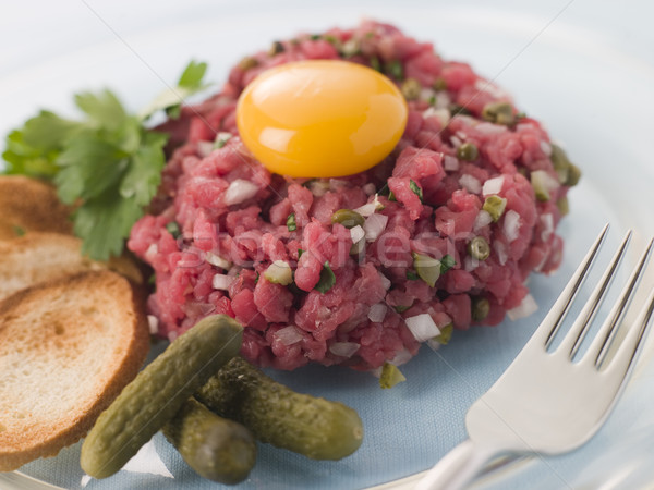 Steak Tartare with Cornichons, Croutons and an Egg Yolk Stock photo © monkey_business