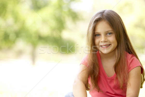 Portrait jeune fille séance parc fille sourire Photo stock © monkey_business