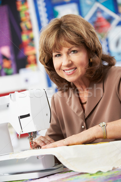 Portrait Of Woman Using Electric Sewing Machine Stock photo © monkey_business