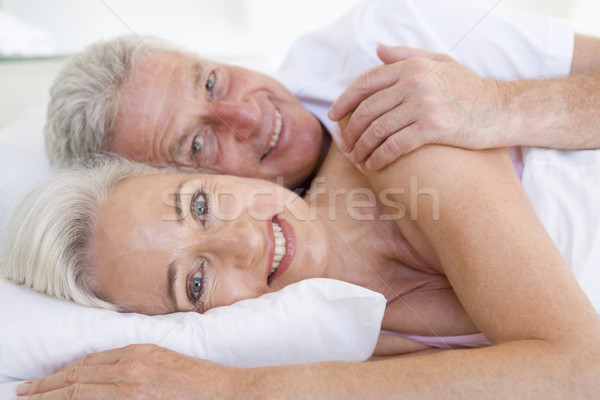 Сток-фото: пару · кровать · вместе · улыбаясь · портрет · спальня