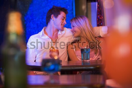 Young woman looking at a young man in a nightclub Stock photo © monkey_business