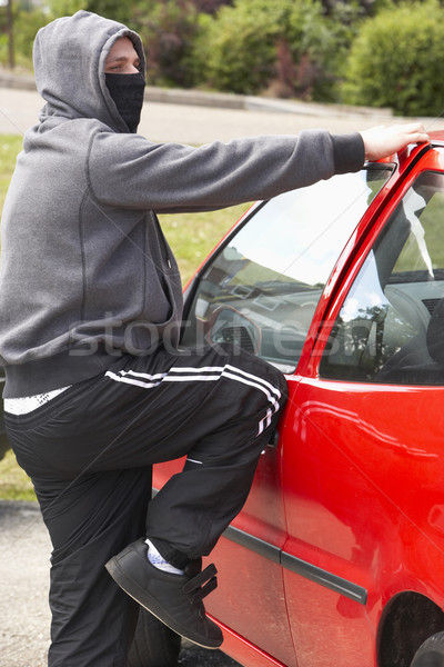 Young Man Breaking Into Car Stock photo © monkey_business