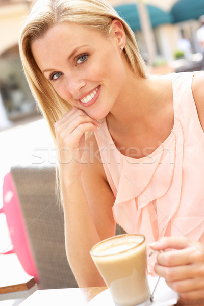Young Woman Enjoying Cup Of Coffee In Caf Stock photo © monkey_business