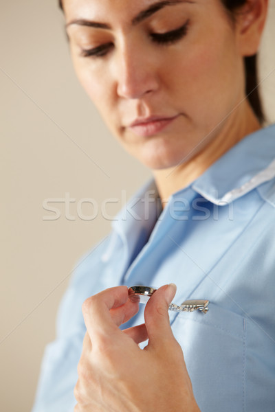 UK nurse looking at watch Stock photo © monkey_business