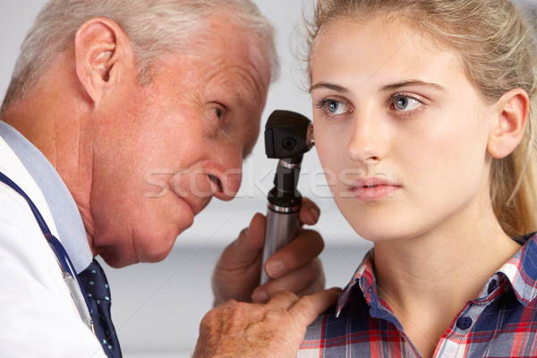 Doctor Examining Teenage Girl's Ears Stock photo © monkey_business