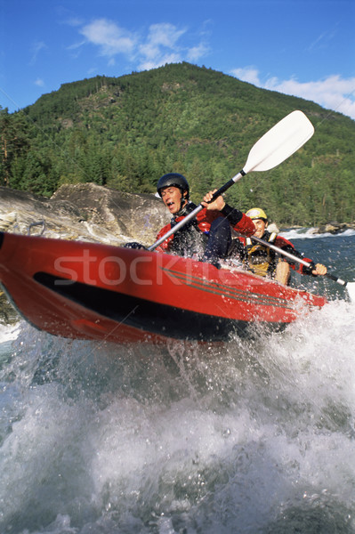 Doua persoane gonflabile barcă jos râu culoare Imagine de stoc © monkey_business