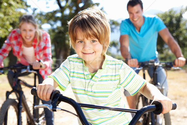Fiatal család vidék bicikli nyár jókedv Stock fotó © monkey_business