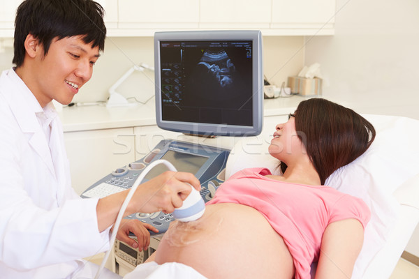 Stock photo: Pregnant Woman Having 4D Ultrasound Scan