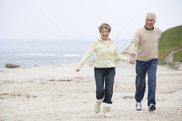 Foto d'archivio: Coppia · spiaggia · holding · hands · sorridere · donna · uomo