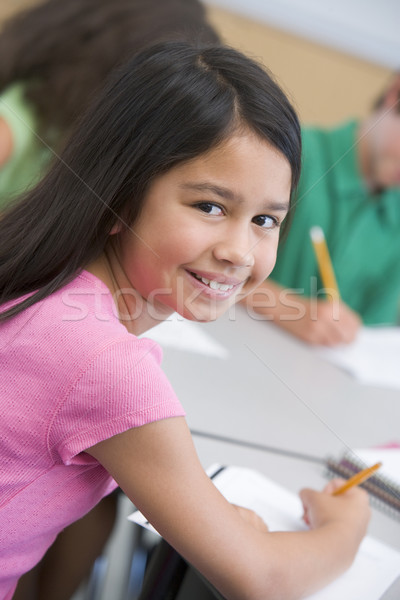 Femeie sală de clasă scris fată copii Imagine de stoc © monkey_business