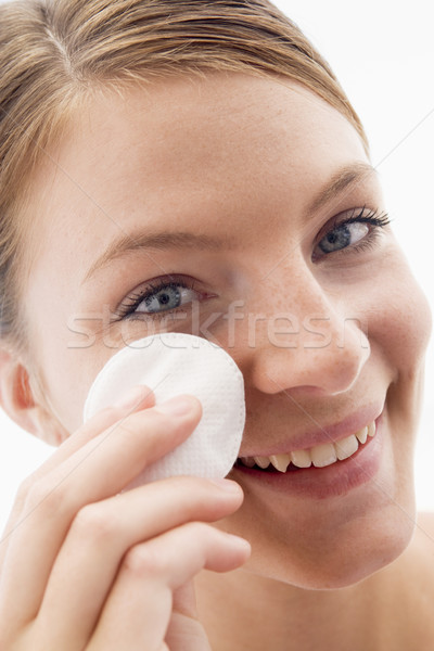 Woman removing makeup and smiling Stock photo © monkey_business