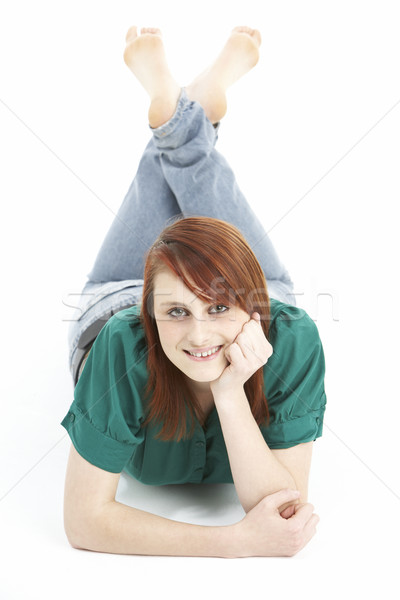 Portrait Of Smiling Teenage Girl Laying On Stomach Stock photo © monkey_business