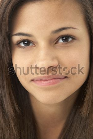 Studio portret zâmbitor fată faţă Imagine de stoc © monkey_business