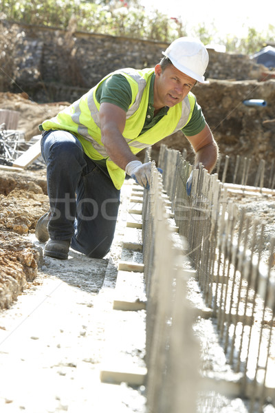 Bouwvakker leggen huis mannen werknemer baan Stockfoto © monkey_business