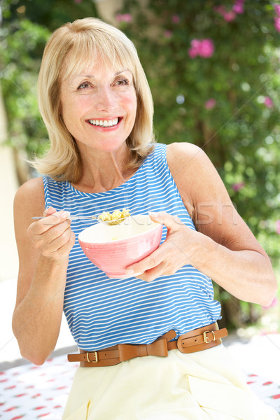 Senior Woman Enjoying Bowl Of Breakfast Cereal Stock photo © monkey_business