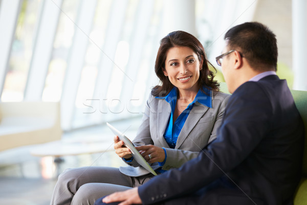 Businesspeople With Digital Tablet Sitting In Modern Office Stock photo © monkey_business