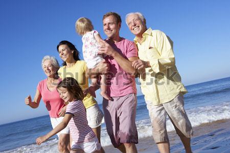 Multi Generation Family Having Fun On Beach Holiday Stock photo © monkey_business