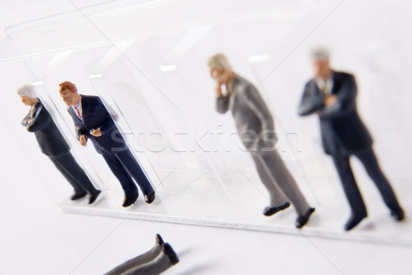 Row Of Businessman Figurines, With One Fallen Out Of Line Stock photo © monkey_business